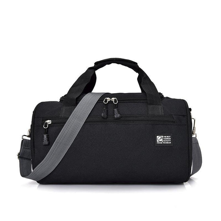 Black duffel gym bag with gray adjustable shoulder strap and front zipper pocket
