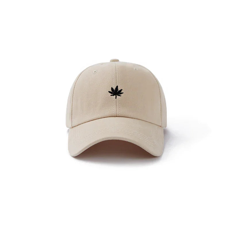 Beige baseball cap with black embroidered leaf logo on front panel