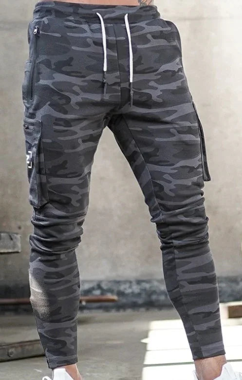 Men's gray camouflage cargo jogger pants with white drawstrings and zipper pockets