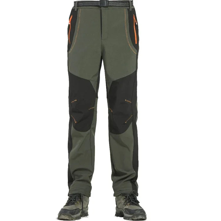 Men's outdoor hiking pants in green and black with orange zipper details and reinforced knees