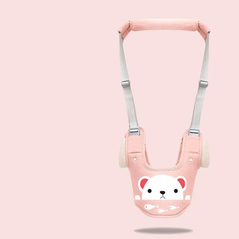 Pink baby safety harness with white bear face and fish design on pastel pink background