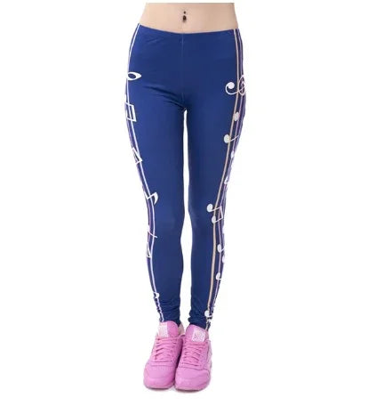 Woman wearing blue leggings with white musical notes print and pink sneakers