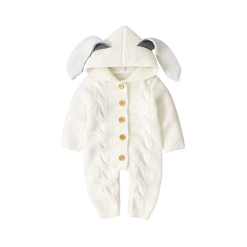 White knitted baby romper with a hood and bunny ears, featuring button closure and cable knit pattern