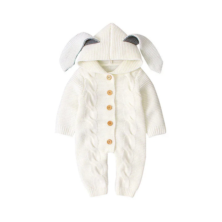 White knitted baby romper with a hood and bunny ears, featuring button closure and cable knit pattern