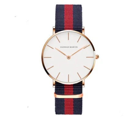 Minimalist Hannari Martin wristwatch with white dial, rose gold case, and navy red striped fabric strap