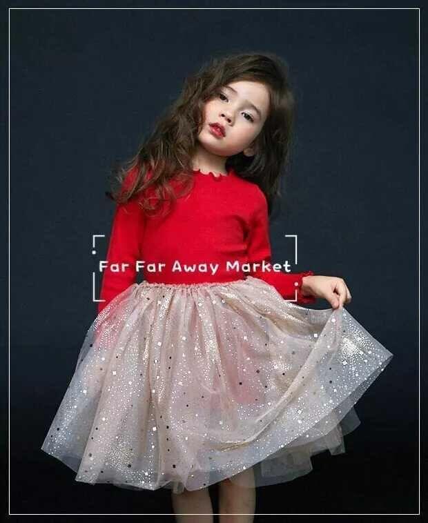 little girl in red sweater and sparkling tulle skirt posing against dark background for Far Far Away Market
