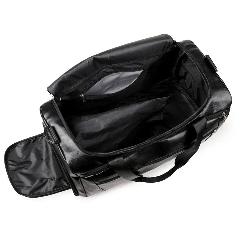 Open black leather duffel bag with zippered compartment and carrying handles