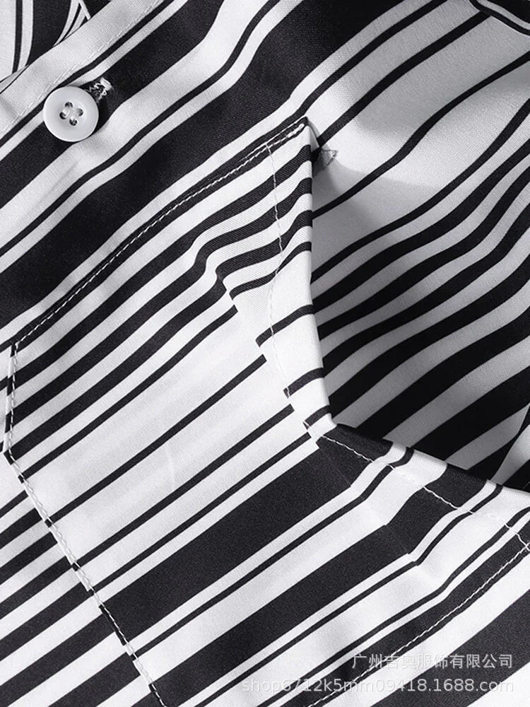 Close-up of black and white striped fabric with stitched pocket and white button on garment