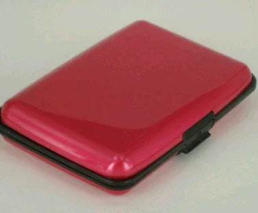 Slim red metallic cigarette case with black clasp on white background