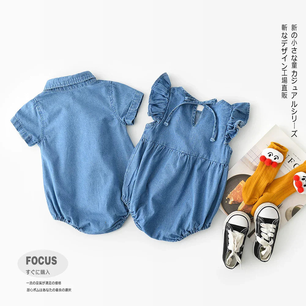 Two blue denim baby rompers with ruffle sleeves and collar, black and white sneakers, and yellow socks with faces