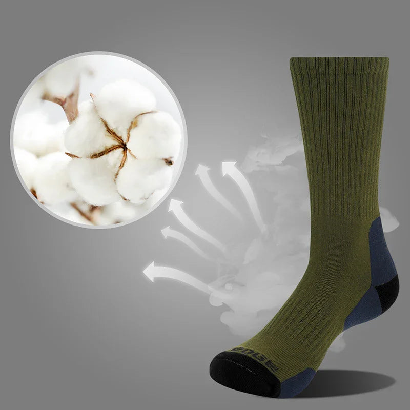 Green breathable cotton sock with black heel and toe, cotton plant inset, airflow arrows on gray background