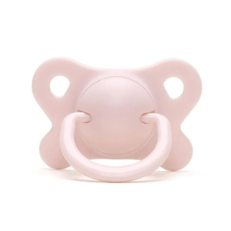 Soft pink baby pacifier with butterfly-shaped shield on white background