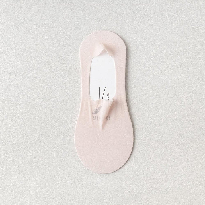 Light pink no-show sock with a textured surface on a white background