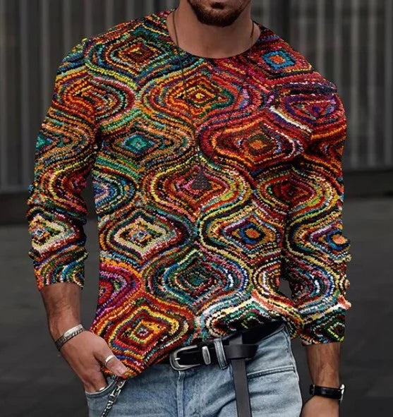 Man wearing a multicolored psychedelic geometric pattern long-sleeve shirt with blue jeans and accessories