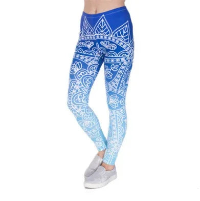 woman wearing blue and white mandala patterned leggings with gray sneakers on white background