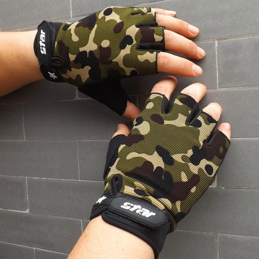 Hands wearing camo fingerless cycling gloves with STAR logo against gray tile wall