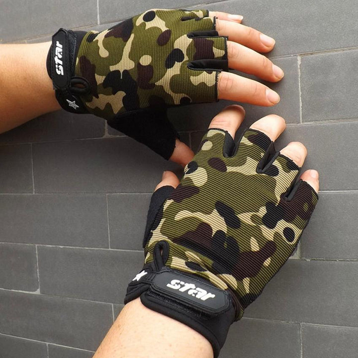 Hands wearing camo fingerless cycling gloves with STAR logo against gray tile wall