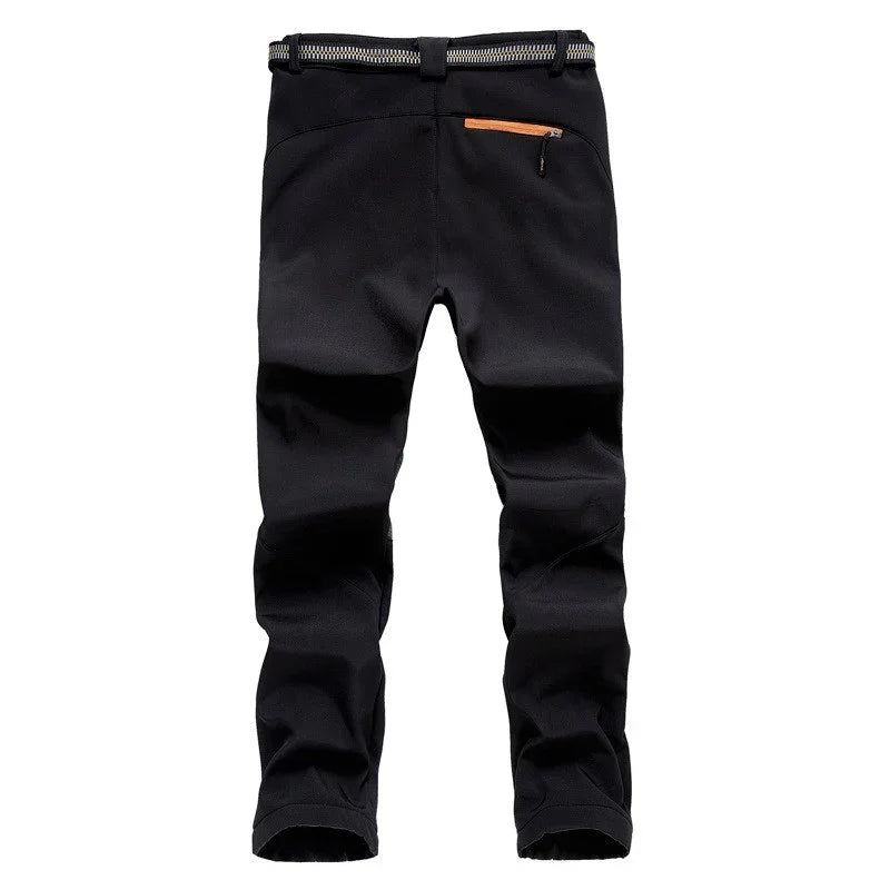 Black outdoor hiking pants with orange zipper pocket and black belt