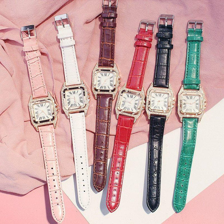 Six elegant wristwatches with square gold cases and Roman numeral dials in pink, white, brown, red, black, and green leather straps