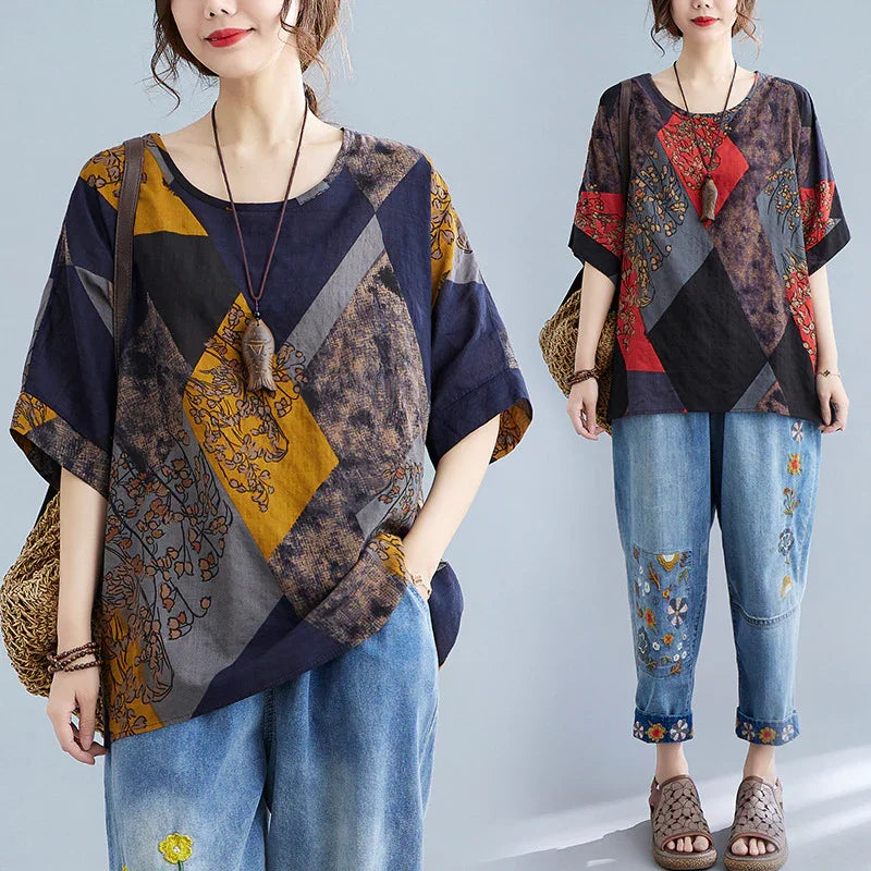 Woman wearing loose patchwork geometric print tops with floral embroidery jeans and woven handbag