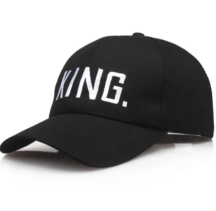 Black baseball cap with white embroidered text KING on front in modern block letters
