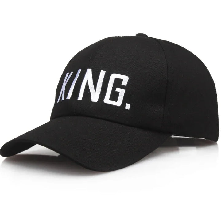 Black baseball cap with white embroidered text KING on front in modern block letters