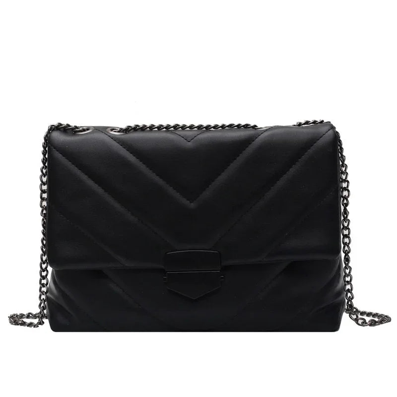 Black quilted leather crossbody bag with chevron pattern and silver chain strap
