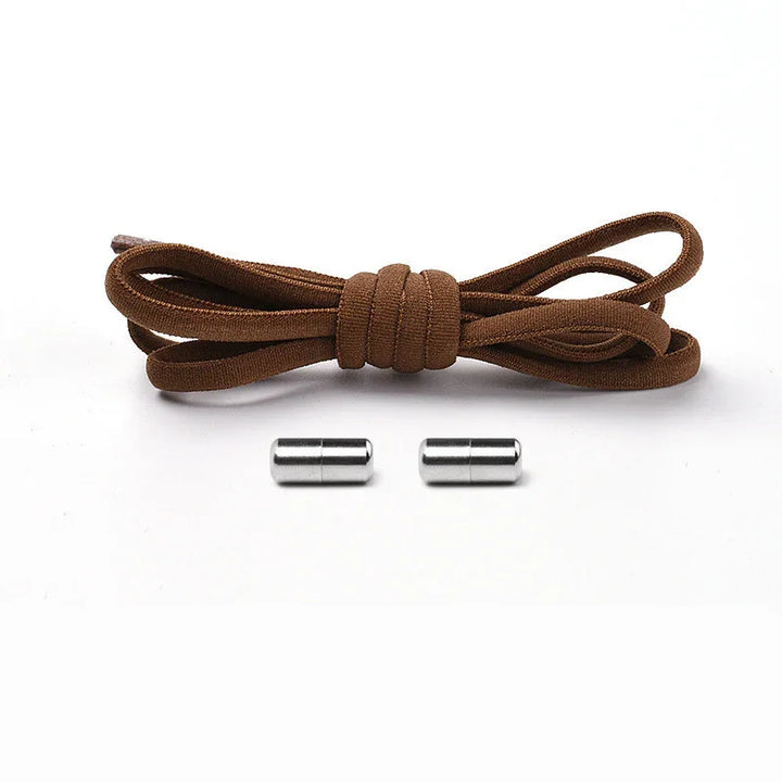 Brown shoelace with two silver aglets on white background