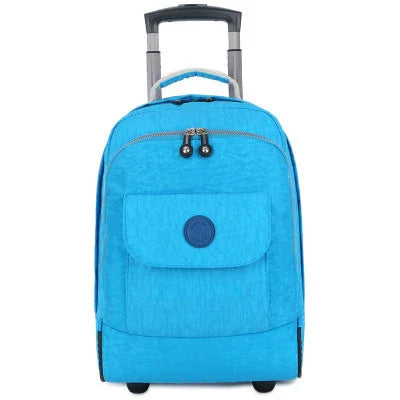 Light blue rolling backpack with front pocket and extendable handle on white background