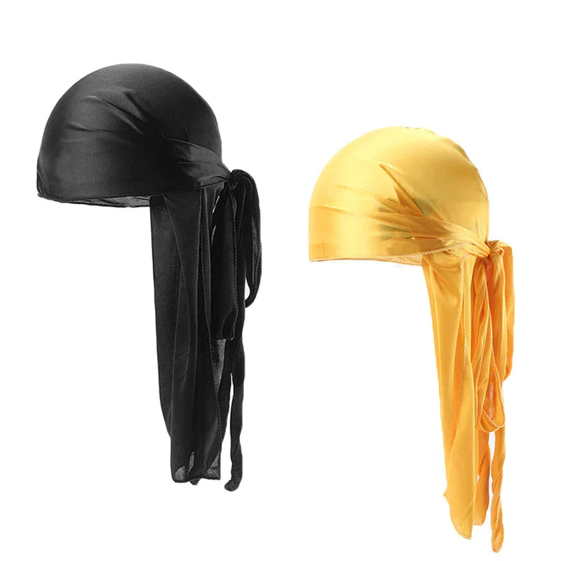 Two smooth satin durags in black and gold colors, displayed on white background