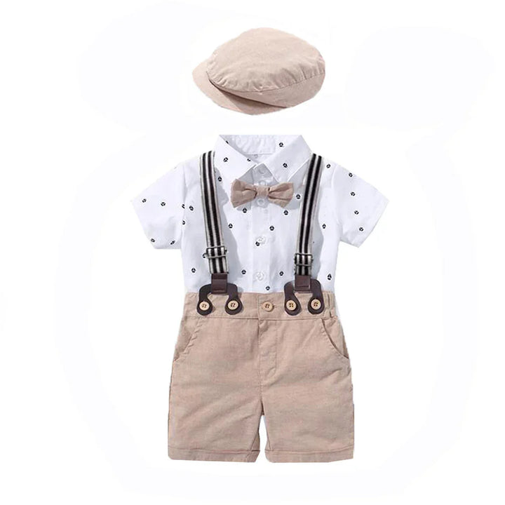 Toddler boy outfit with beige cap, white short-sleeve shirt, bow tie, suspenders, and beige shorts