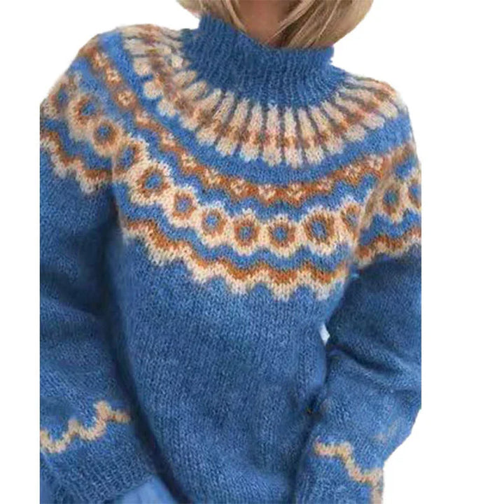 Close-up of blue knitted sweater with multicolor Nordic pattern and high neckline