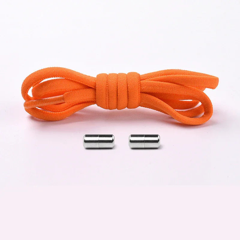 Orange elastic shoelaces with two silver magnetic clasps on a white background