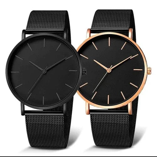 Two minimalist wristwatches with black mesh straps, one with black case and the other with rose gold case