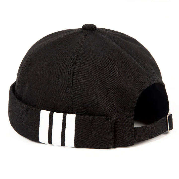 Black cotton baseball cap with white stripe detail on the adjustable back strap
