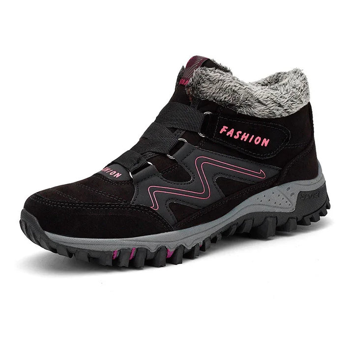 Black winter hiking boot with pink accents, faux fur lining, and rugged gray sole