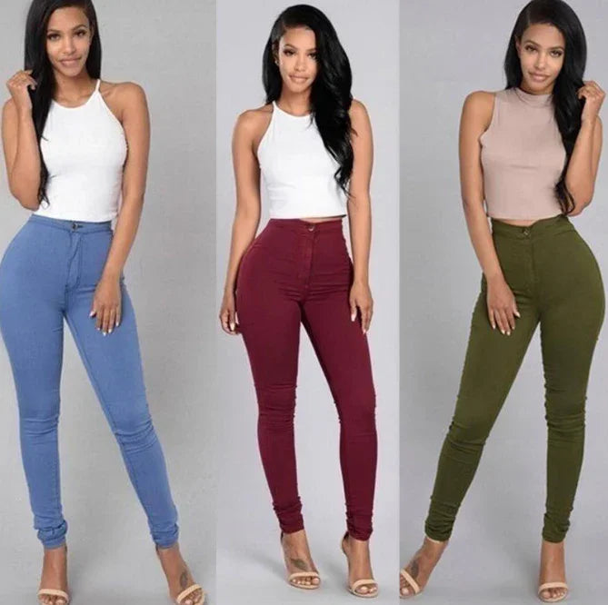 Three women modeling high-waisted skinny jeans in blue, burgundy, and olive green with sleeveless tops