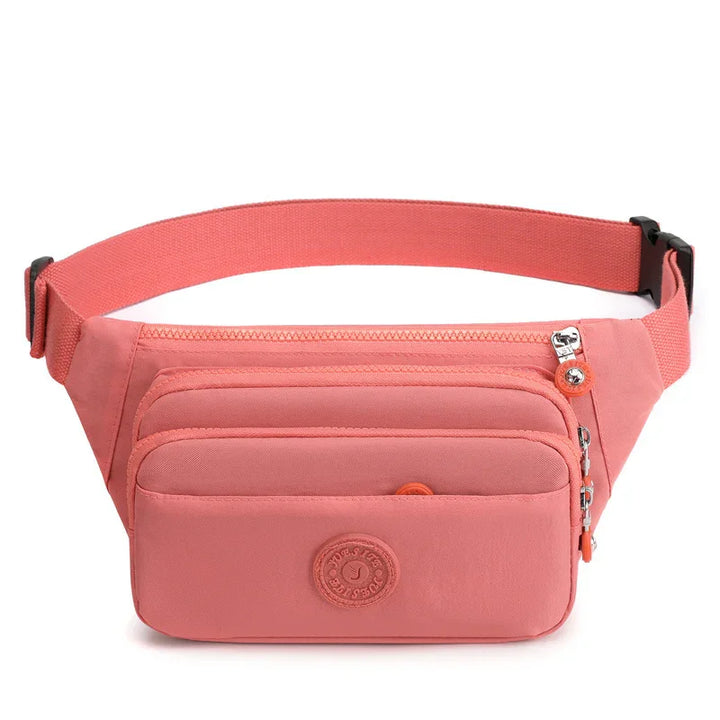 Coral pink nylon waist bag with adjustable strap and multiple zippered pockets