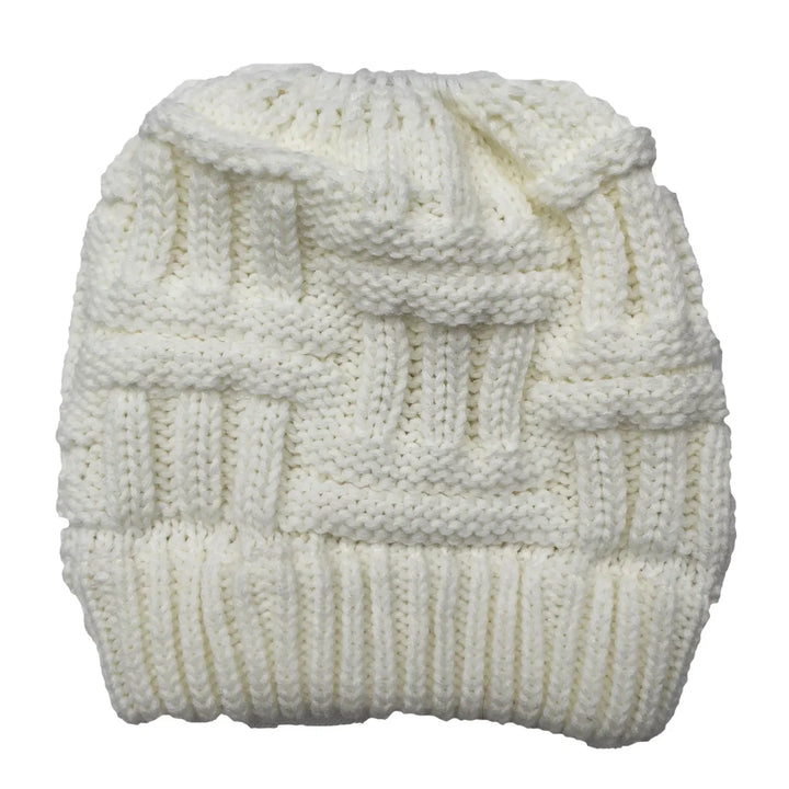 Soft white knitted beanie with textured basket weave pattern and ribbed cuff