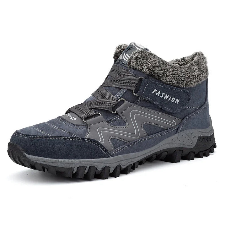 grey high-top hiking boot with fur collar, rugged sole, and decorative zigzag stitching