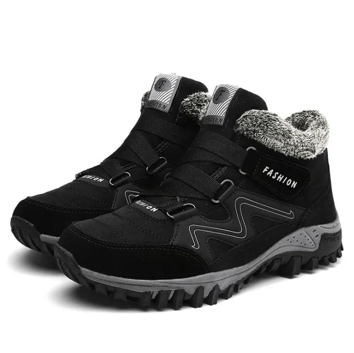 Black winter hiking boots with gray fur lining, rugged soles, and fashion branding on sides