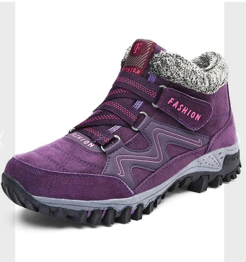 Purple suede hiking boot with thick black sole, pink accents, and gray knit ankle collar