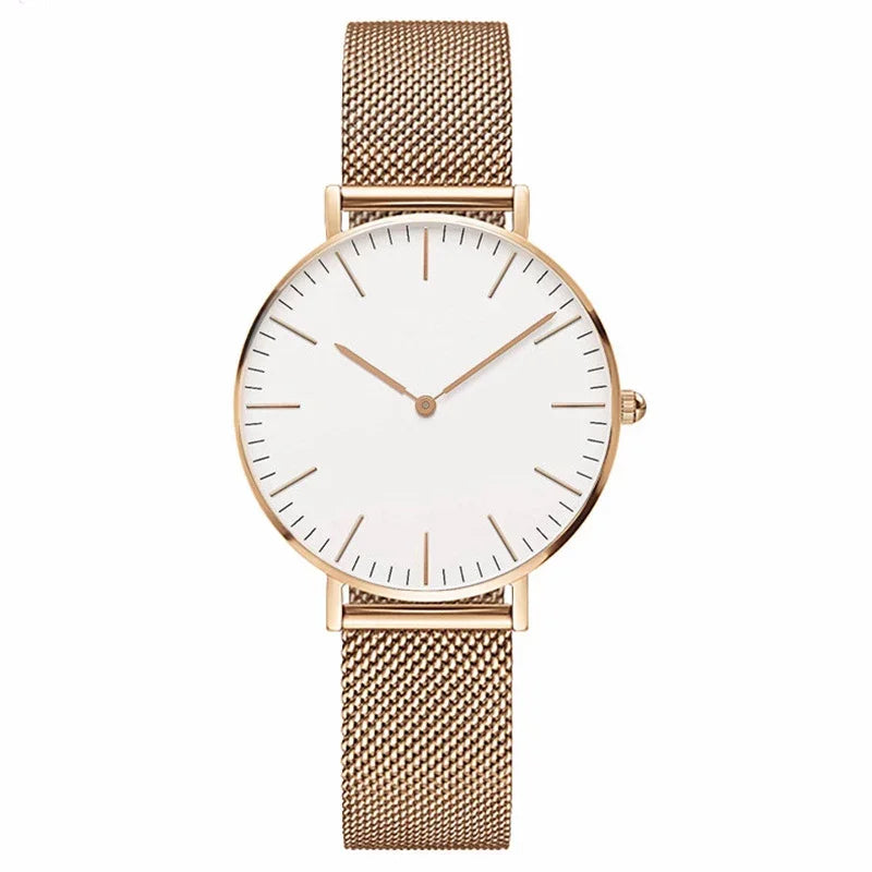 Minimalist rose gold wristwatch with white dial and mesh strap
