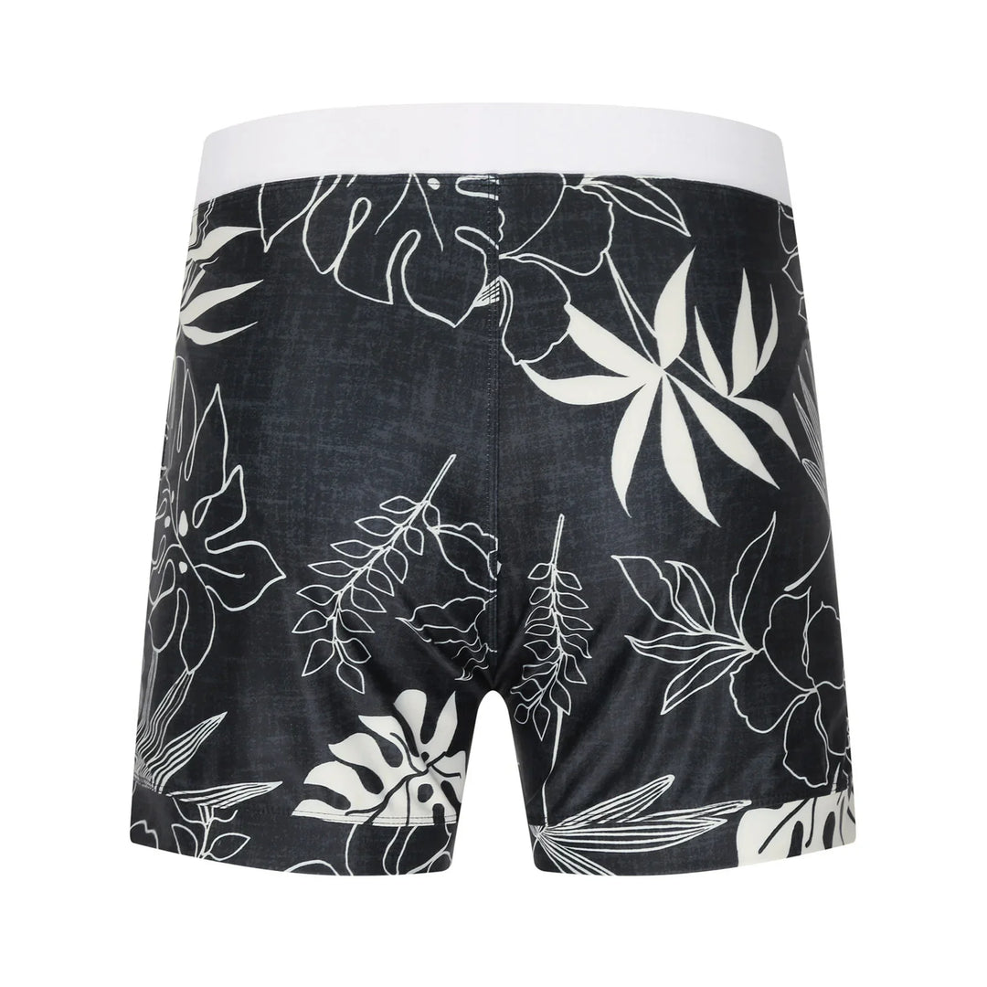 Black boxer briefs with white tropical leaf and floral pattern and white waistband