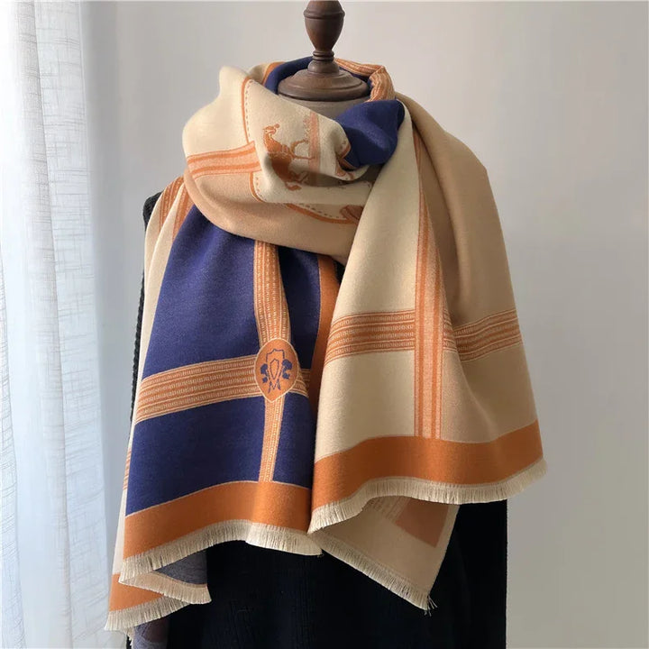 Elegant scarf with navy blue, beige, and orange plaid pattern draped on a wooden mannequin