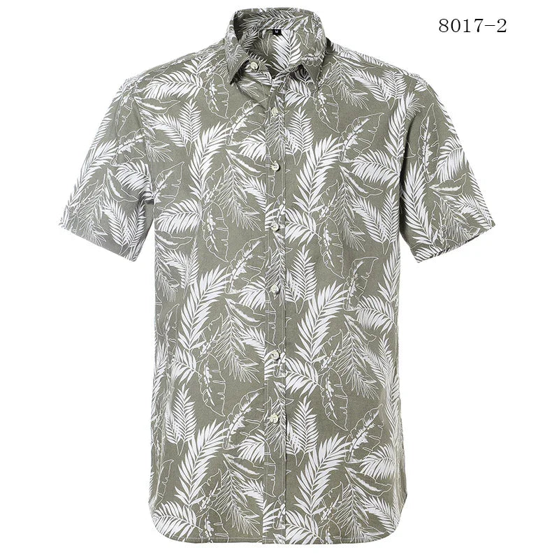 Men's short sleeve button-up shirt with green background and white tropical leaf print