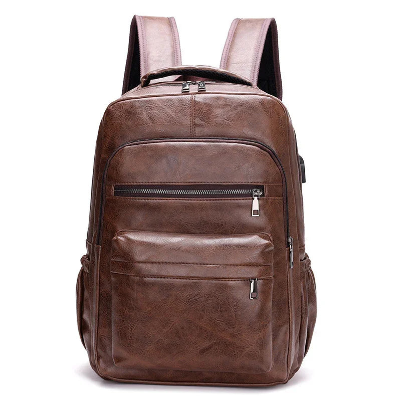 Brown leather backpack with multiple zippered pockets and padded shoulder straps