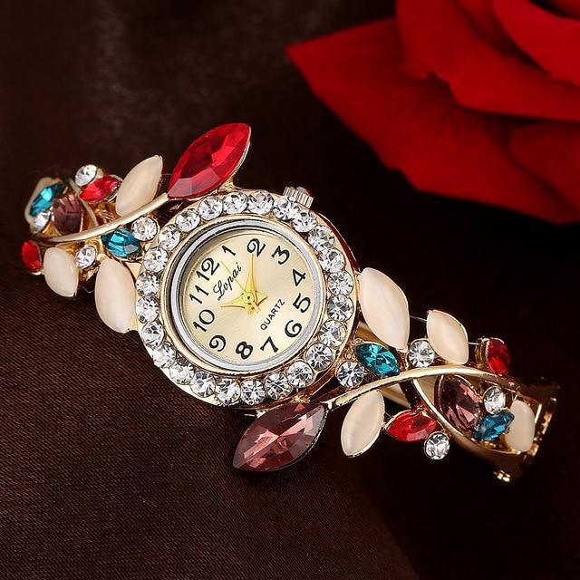 Elegant Geneva quartz wristwatch with crystal-studded bezel and colorful gemstone leaf bracelet