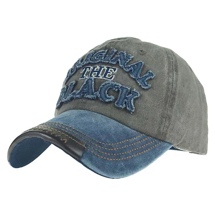 Two-tone gray and blue denim baseball cap with frayed embroidered text "ORIGINAL THE BLACK"
