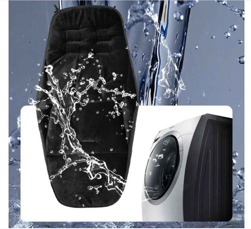 Black cushioned seat cover being splashed with water, next to a modern front-loading washing machine